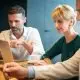 technology-devices-in-hands-of-business-people-at-cafe.jpg